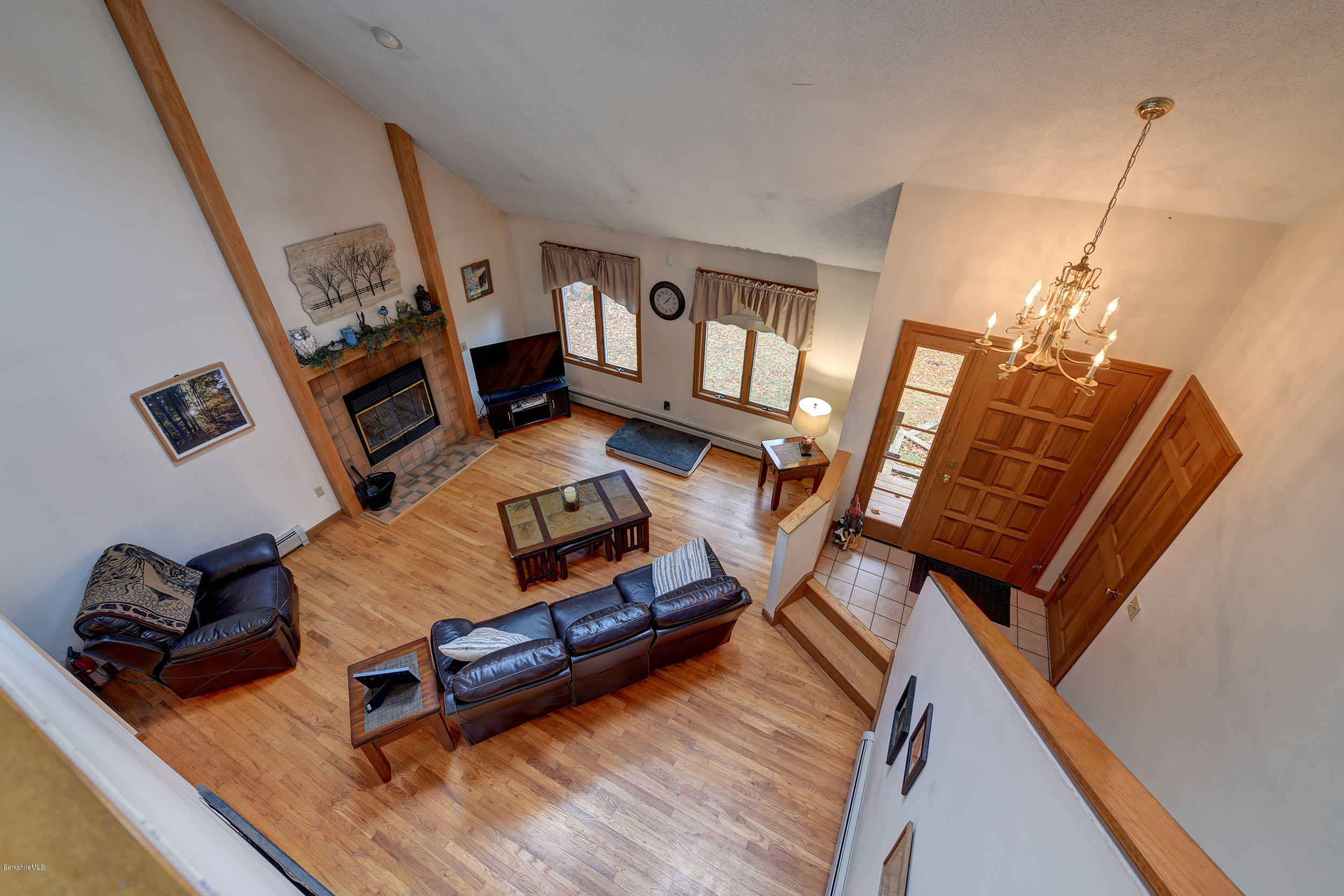 99 Jacobs Hollow Road Becket, MA 01223 - Photo 31 of 39 a living room with furniture and a wooden floor