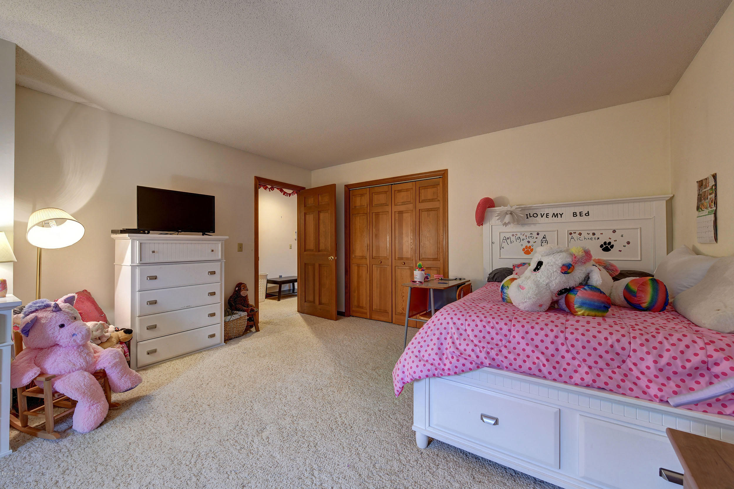 99 Jacobs Hollow Road Becket, MA 01223 - Photo 36 of 39 a bedroom with a bed and a tv