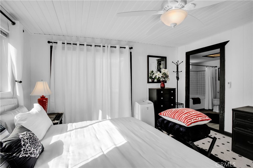 49490 Big Morongo Canyon Road Morongo Valley, CA 92256 - Photo 23 of 75 a bedroom with bed and wooden floor