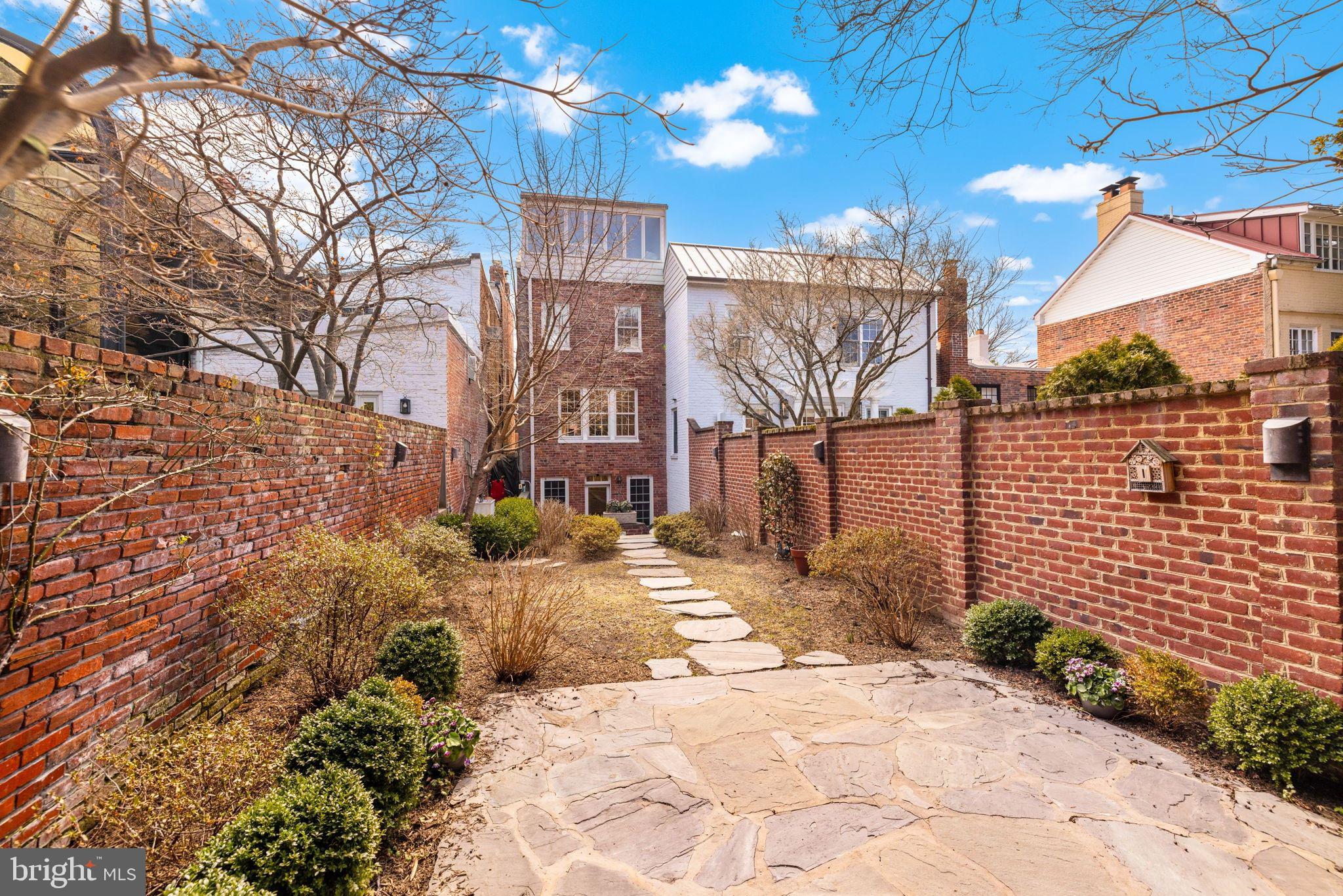 3127 O Street Northwest Washington, DC 20007 - Photo 11 of 13 a view of a pathway with a building in the background