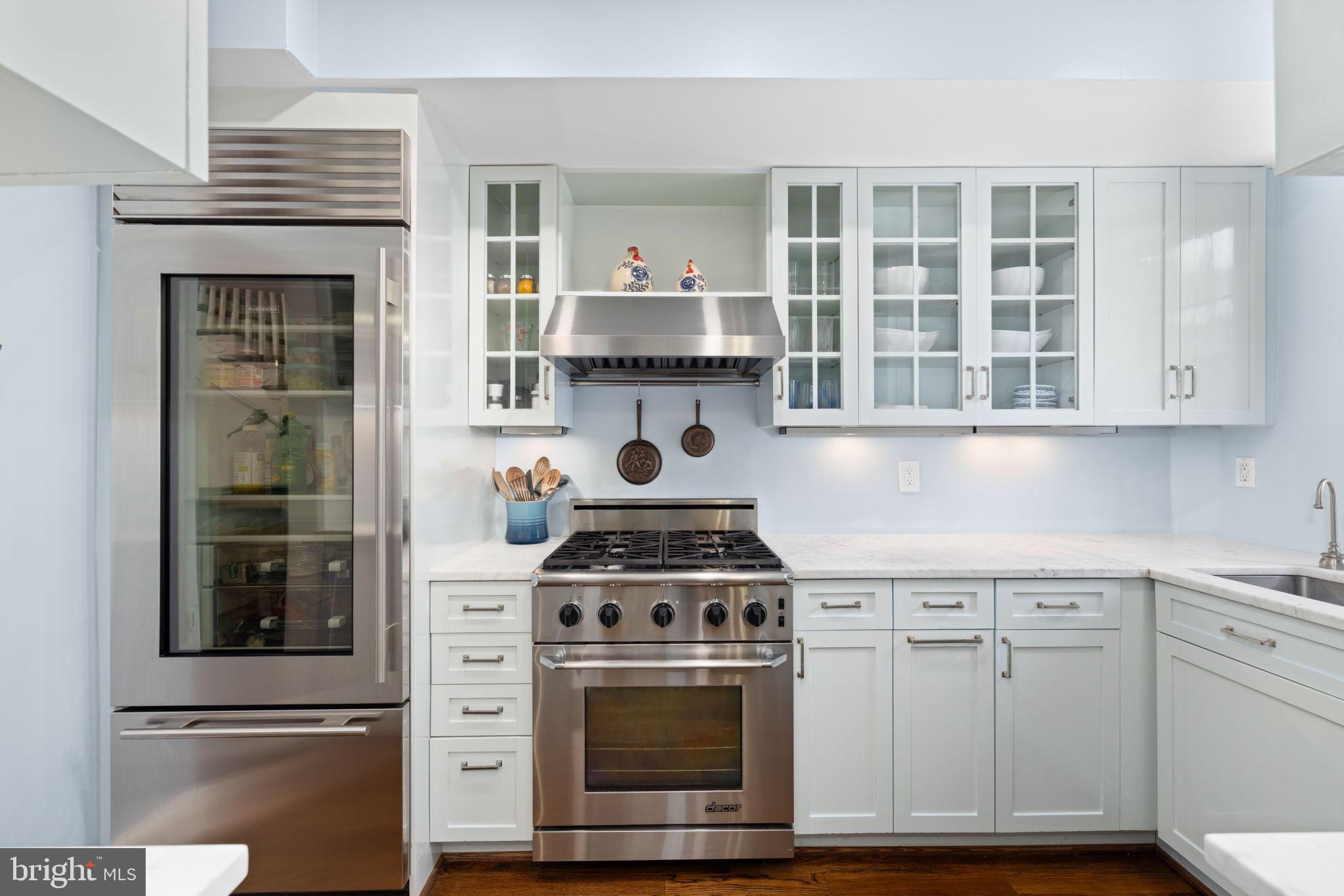 3127 O Street Northwest Washington, DC 20007 - Photo 2 of 11 a stove top oven sitting inside of a kitchen