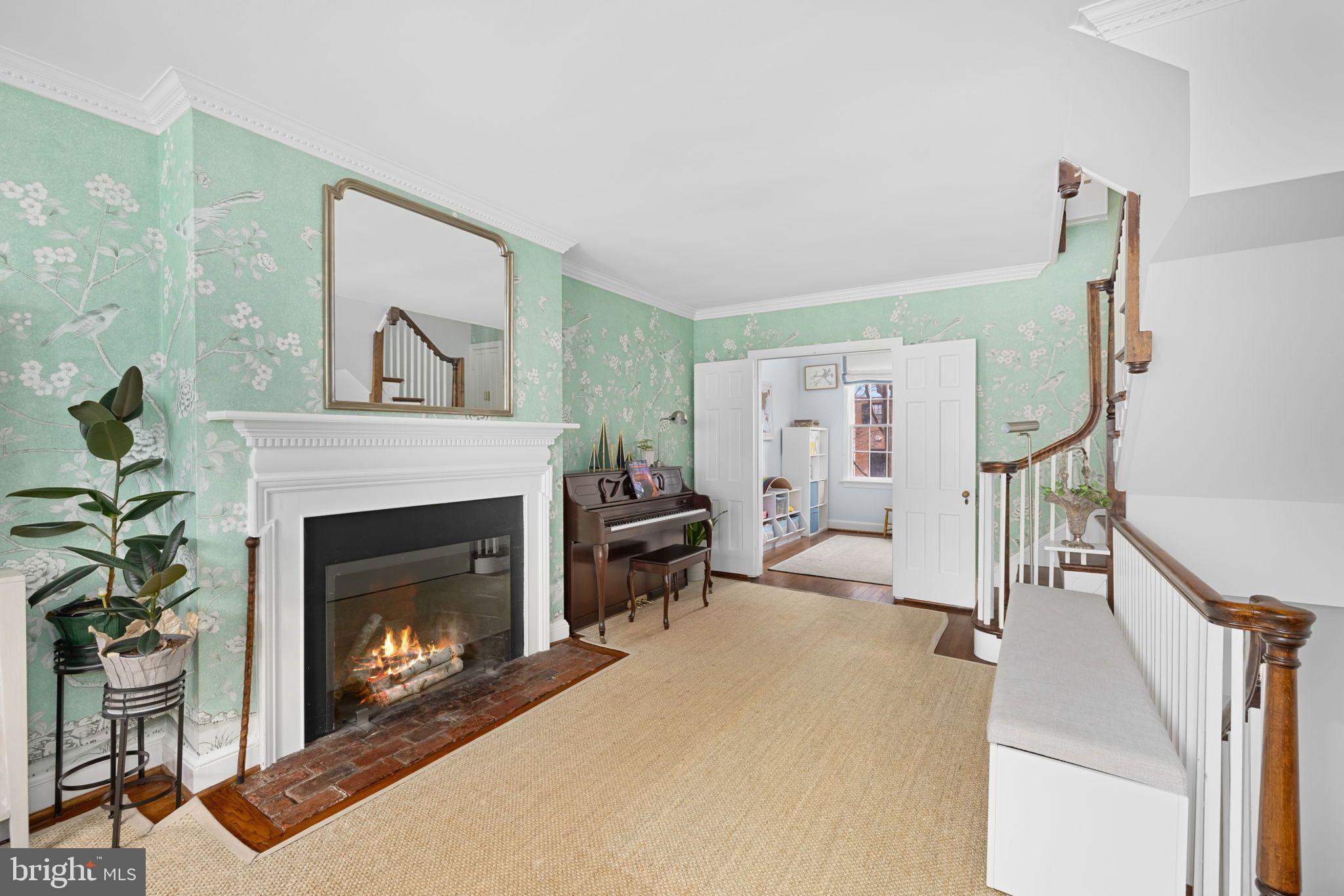 3127 O Street Northwest Washington, DC 20007 - Photo 4 of 11 a living room with furniture and a fireplace