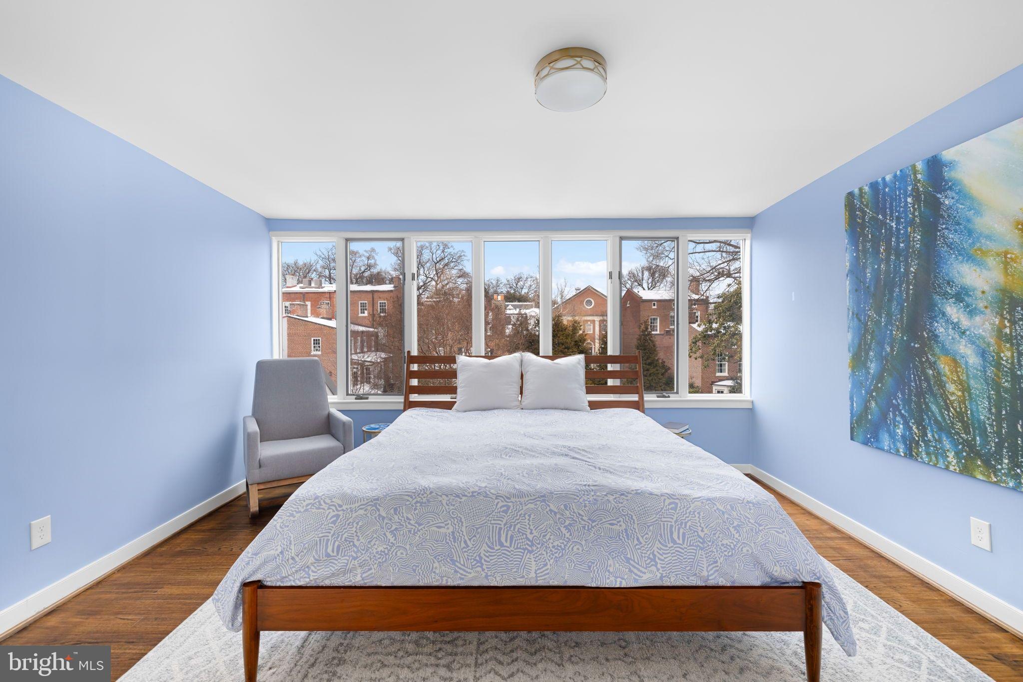 3127 O Street Northwest Washington, DC 20007 - Photo 10 of 13 a bedroom with a large bed and a large window
