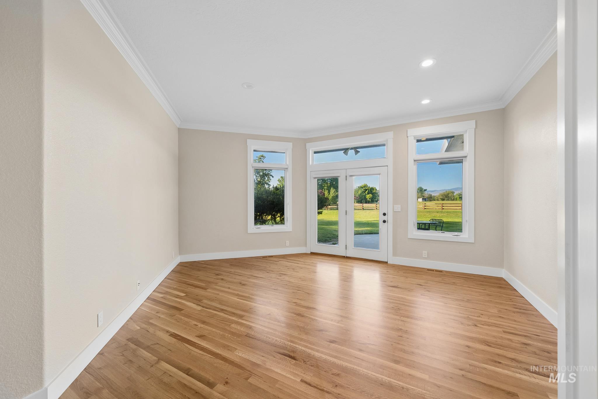 2050 Artesian Road Eagle, ID 83616 - Photo 45 of 49 Spacious room featuring wood-finish flooring, recessed lighting, and crown molding