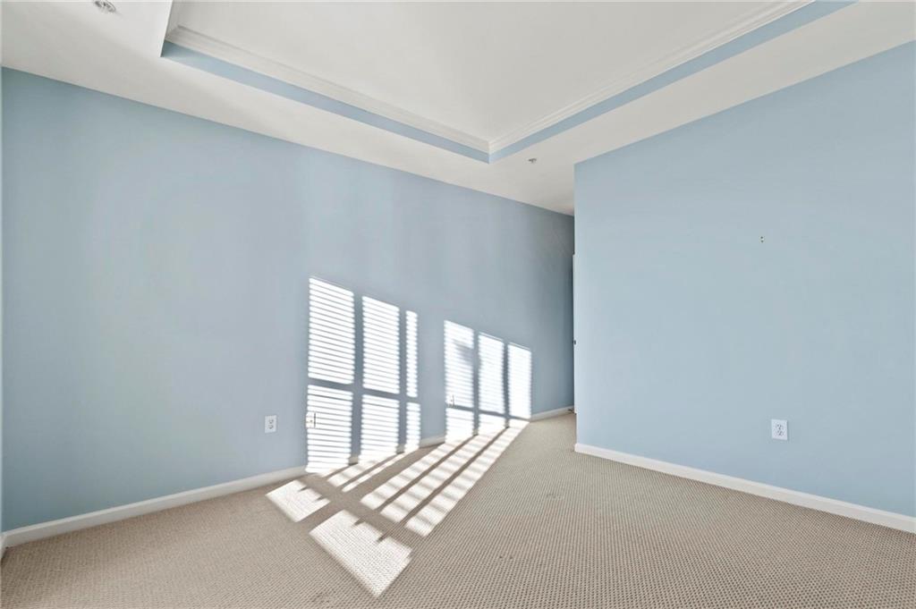 3334 Peachtree Road Northeast, Unit 1207 Atlanta, GA 30326 - Photo 12 of 31 a view of an empty room with a balcony