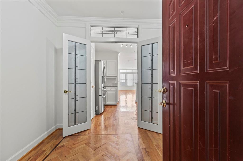 3334 Peachtree Road Northeast, Unit 1207 Atlanta, GA 30326 - Photo 2 of 31 a view of a hallway with wooden floor and entryway