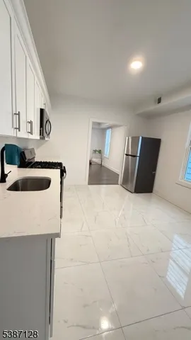 a view of a bedroom with a bed