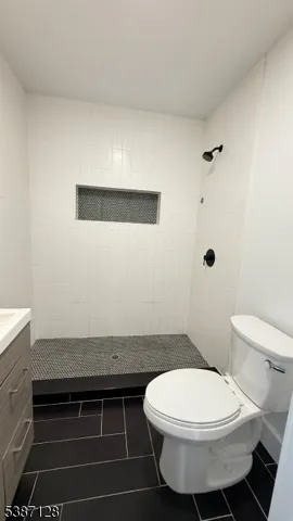 a bathroom with a toilet and a sink