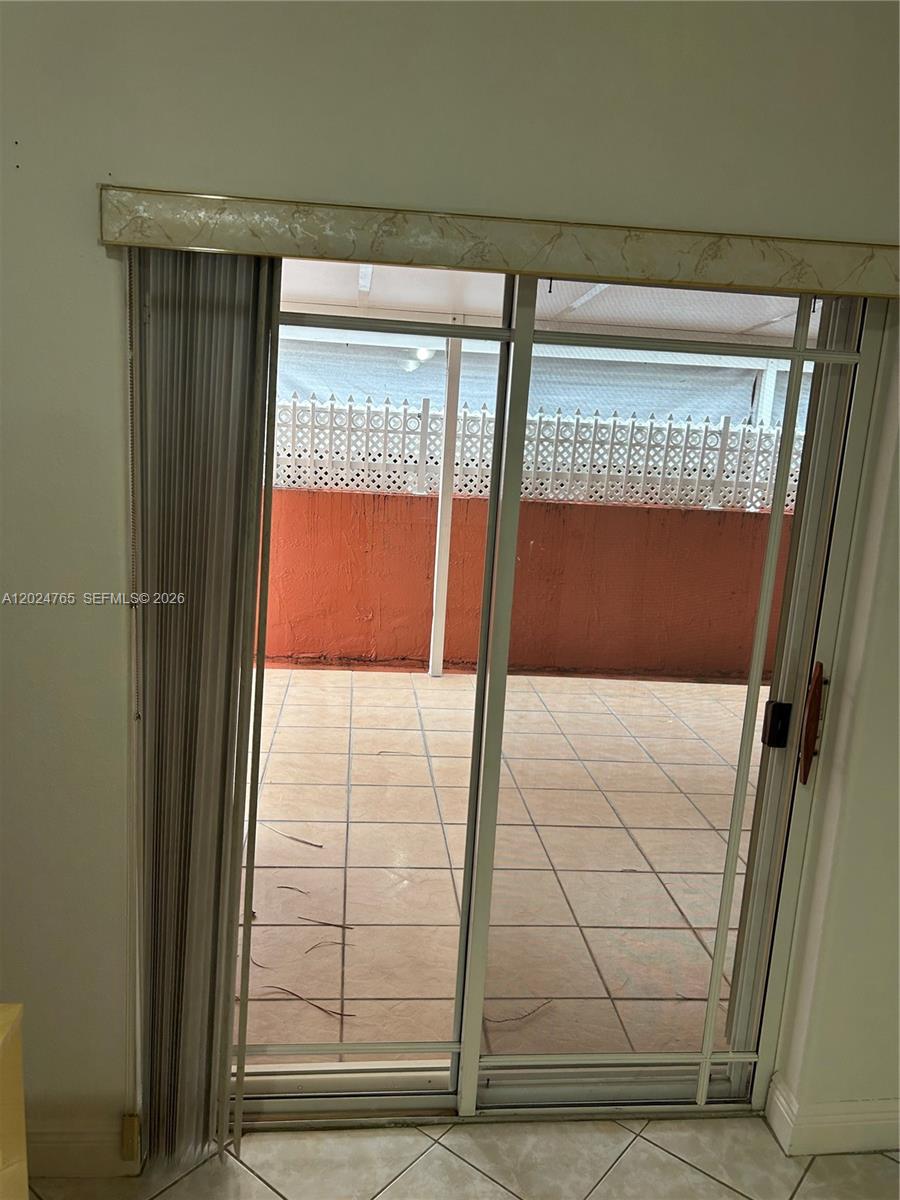 10919 West Okeechobee Road, Unit 101 Hialeah Gardens, FL 33018 - Photo 10 of 21 a view of entryway