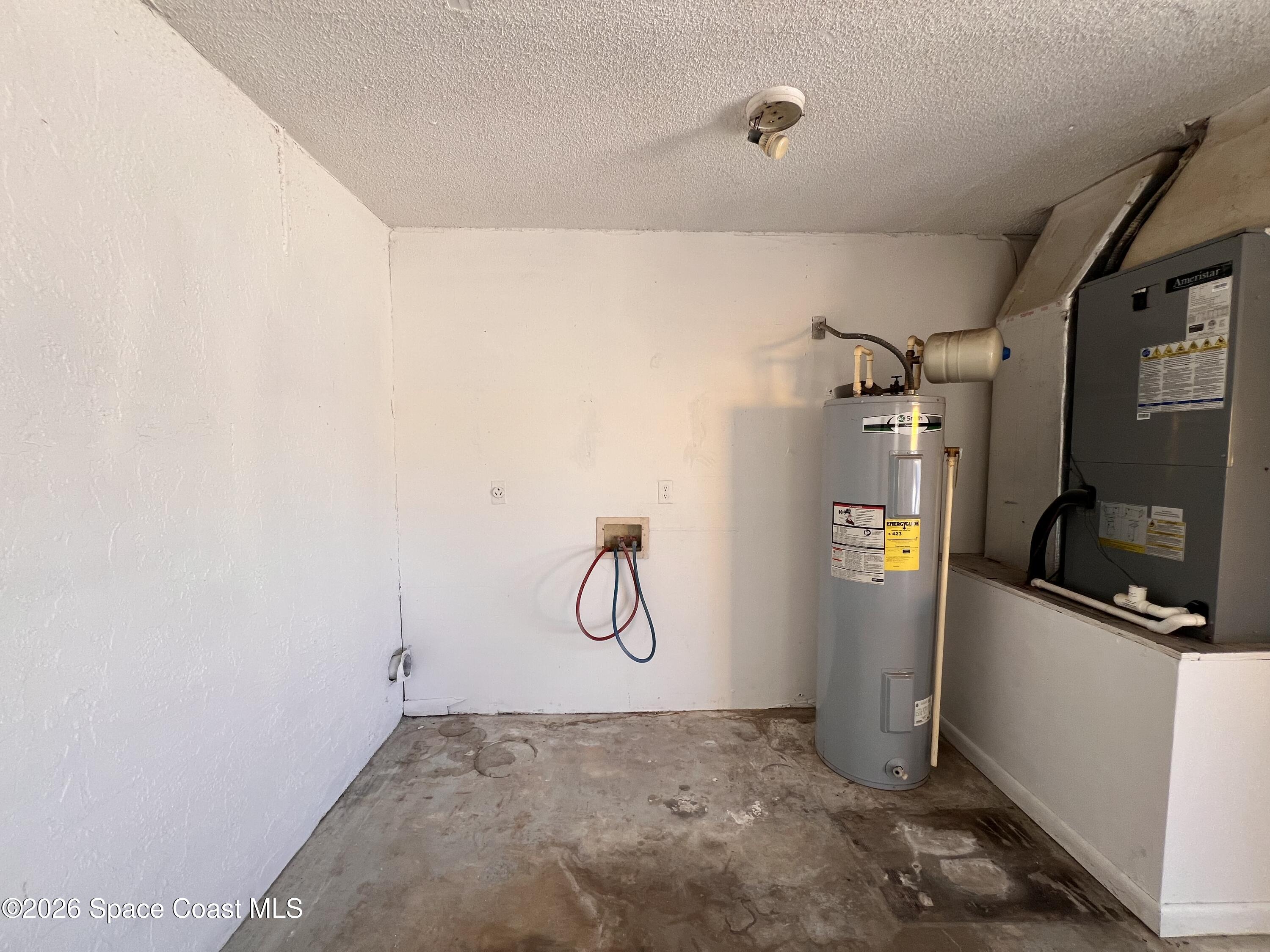 1456 Reed Street Northwest Palm Bay, FL 32907 - Photo 17 of 19 a view of storage and utility room with projector and racks