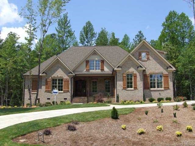 5136 Terra Cotta Drive Raleigh, NC 27613 - Photo 1 of 12 a front view of a house with garden