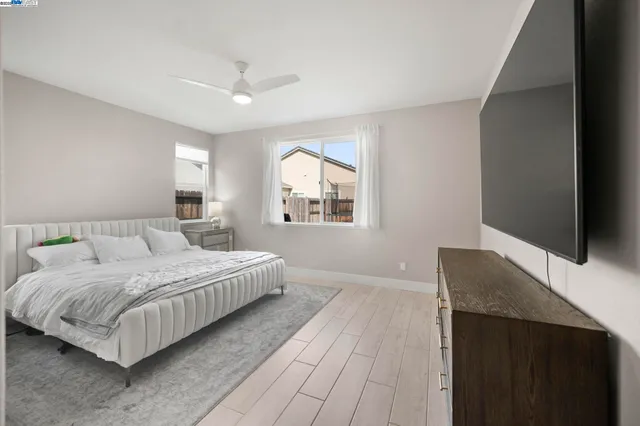 a bedroom with double bed and a window