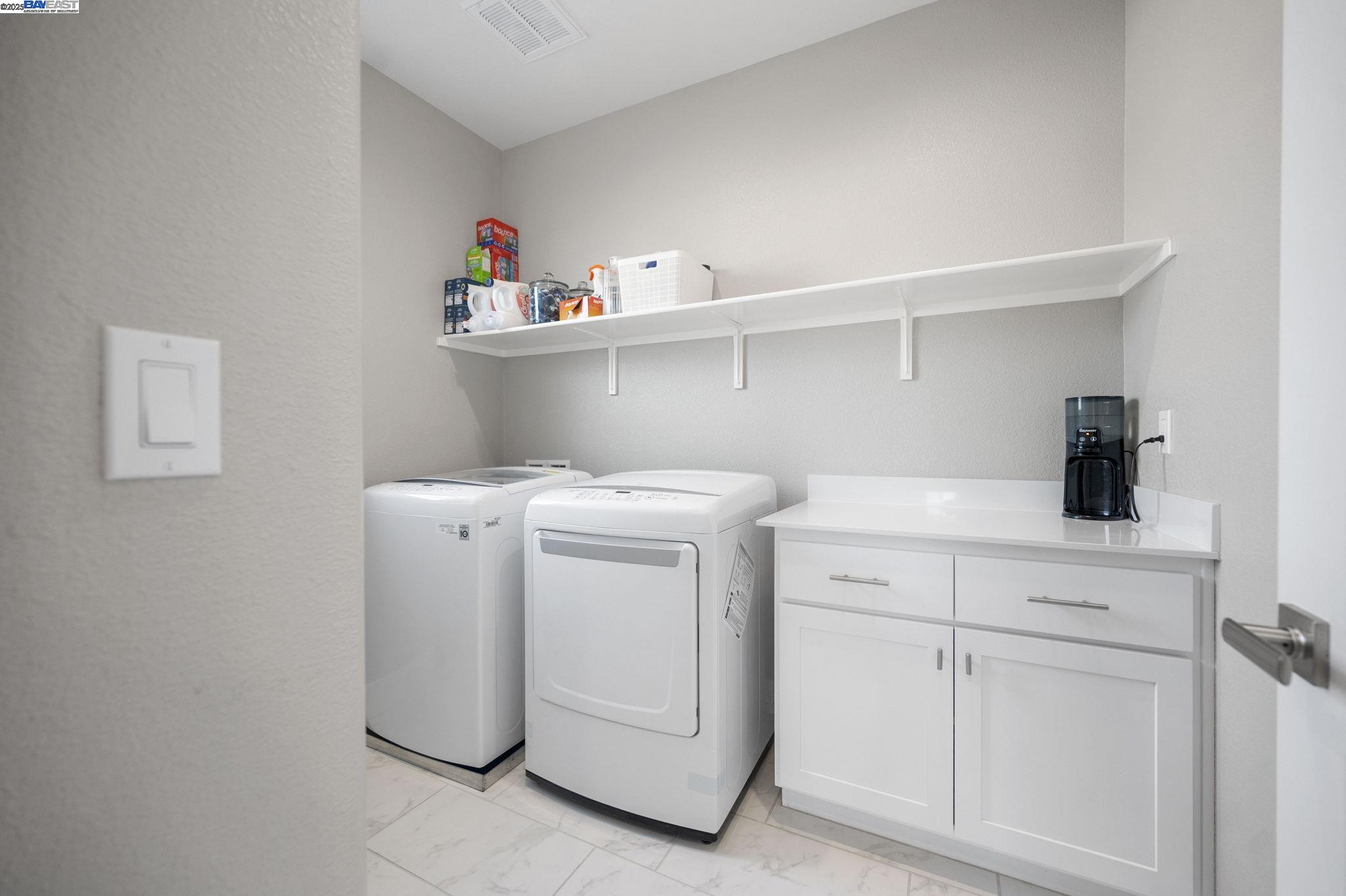 1605 Radiance Lane Modesto, CA 95356 - Photo 29 of 35 a utility room with dryer and washer