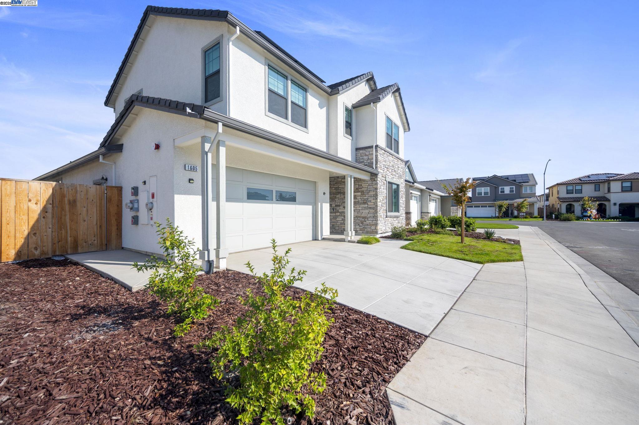 1605 Radiance Lane Modesto, CA 95356 - Photo 34 of 35 a house with garden in front of it