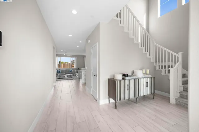 a view of hallway with wooden floor