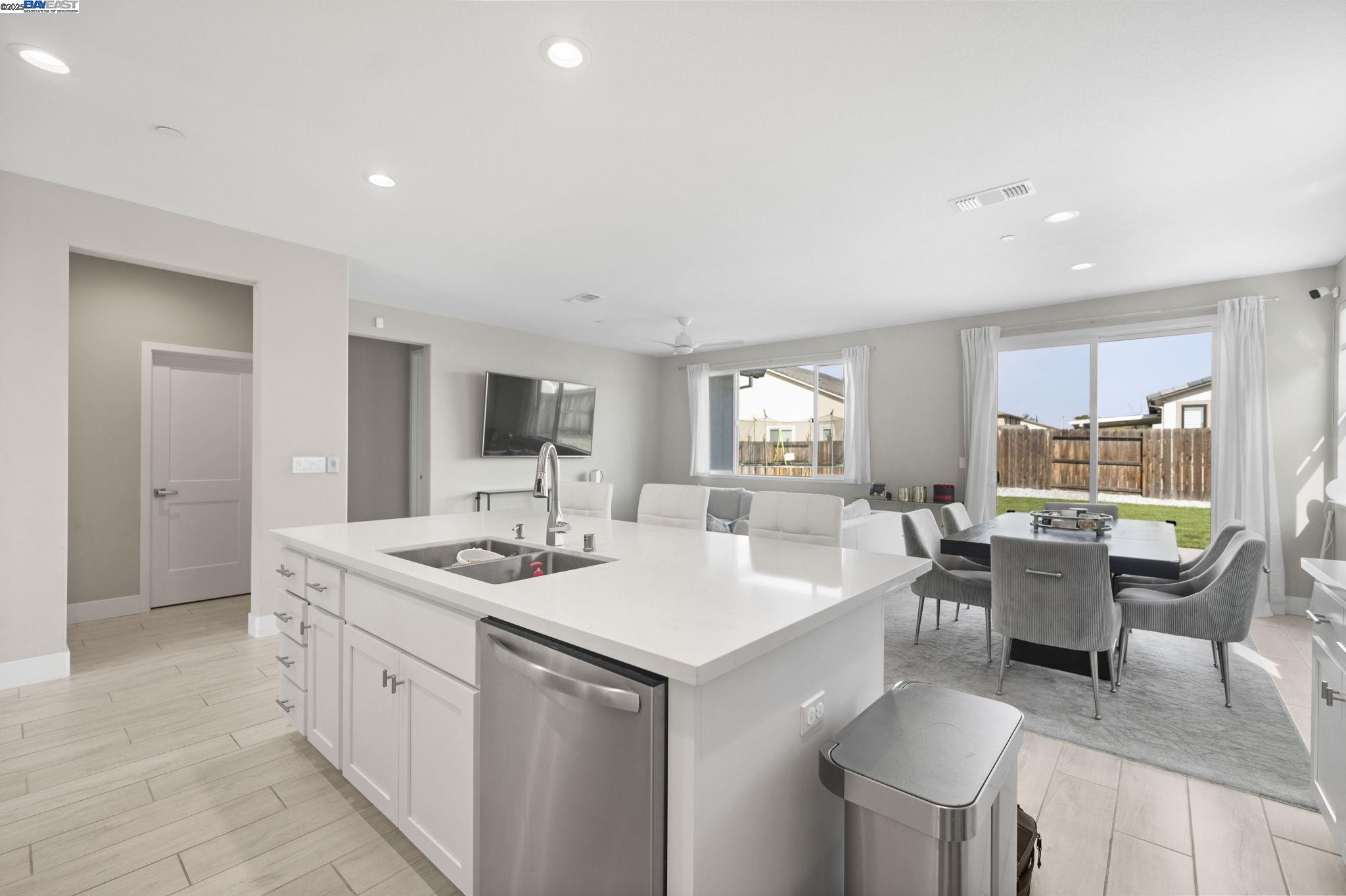 1605 Radiance Lane Modesto, CA 95356 - Photo 9 of 35 a room with a sink dining table and chairs