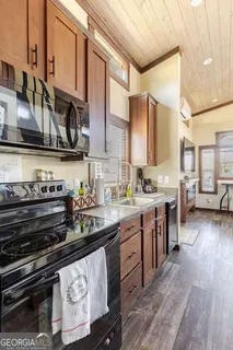 a view of staircase with white walls and a window