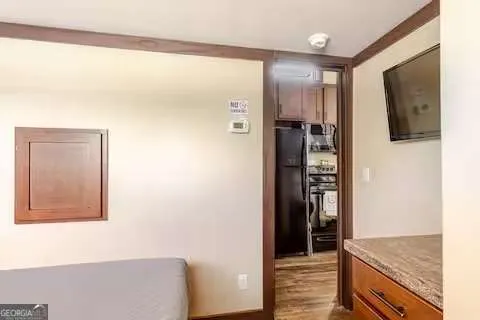 a bathroom with a granite countertop sink toilet a mirror and tub