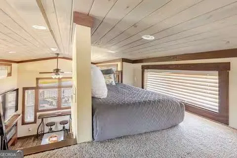 a view of a bedroom with windows