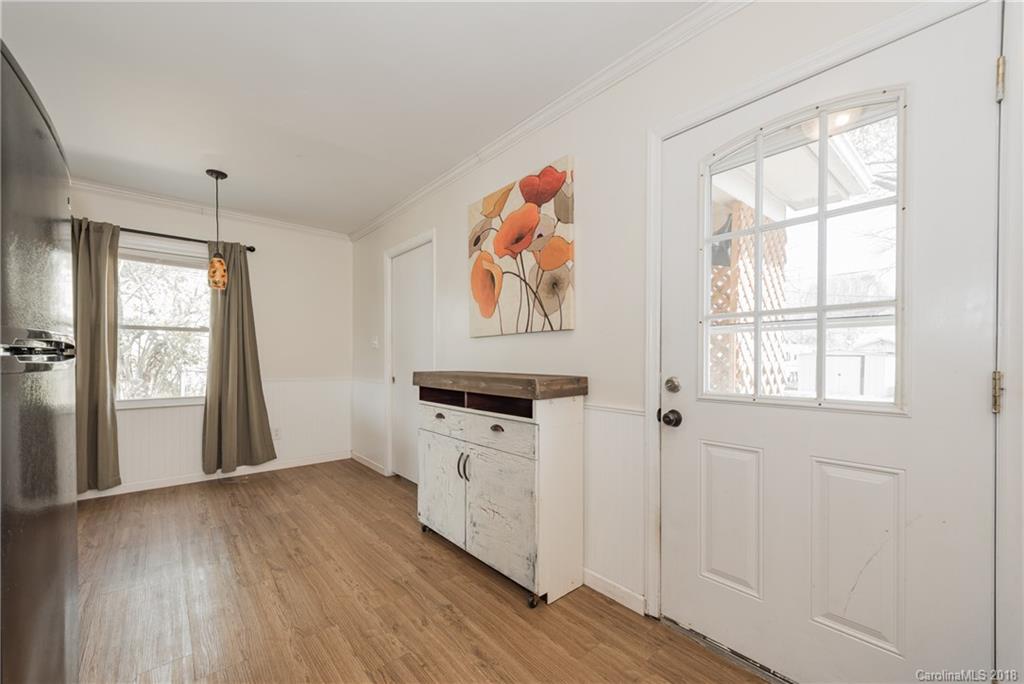 8002 Wynnview Road Indian Trail, NC 28079 - Photo 13 of 24 an entryway with wooden floor and cabinet