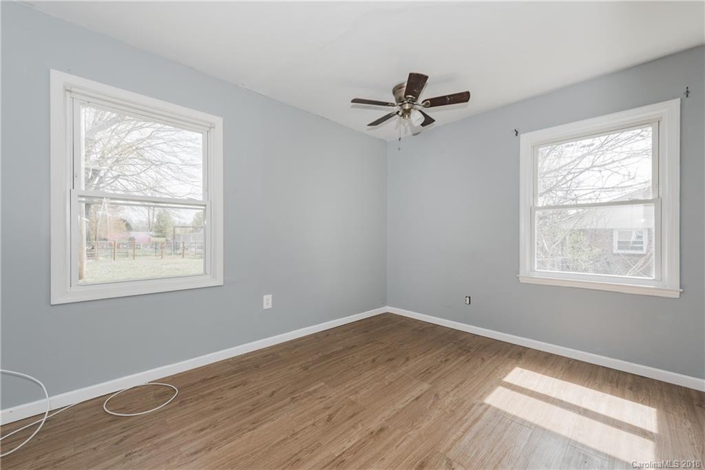 8002 Wynnview Road Indian Trail, NC 28079 - Photo 14 of 24 a view of a room with wooden floor and windows