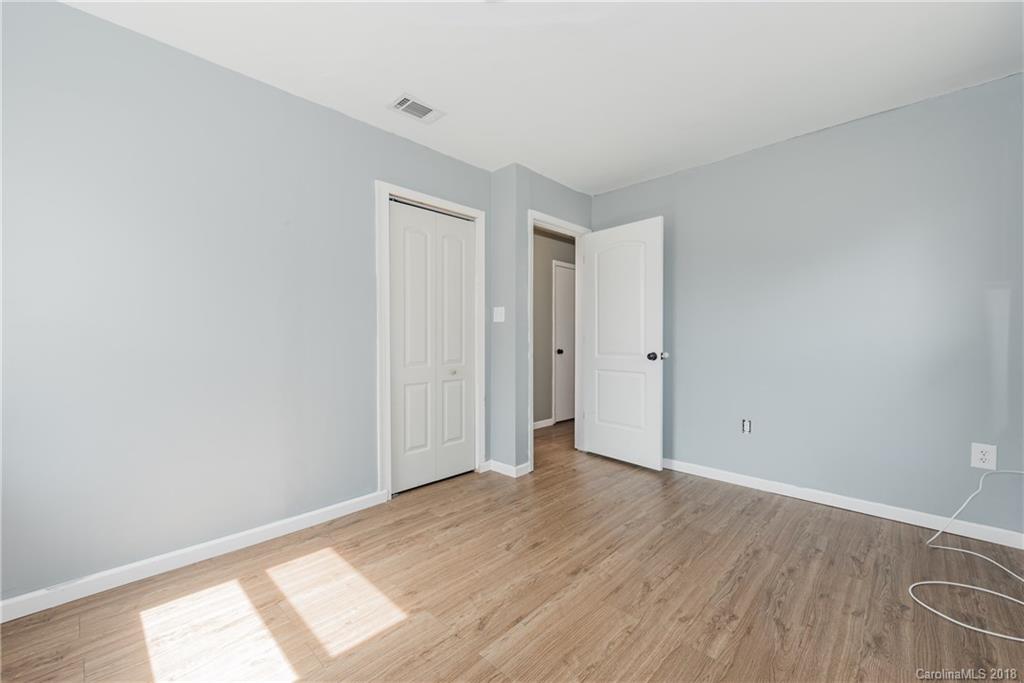 8002 Wynnview Road Indian Trail, NC 28079 - Photo 15 of 24 a view of an empty room with wooden floor