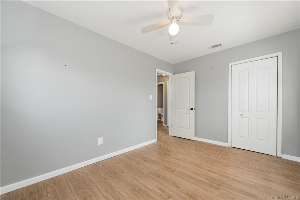 8002 Wynnview Road Indian Trail, NC 28079 - Photo 17 of 24 a view of an empty room with wooden floor