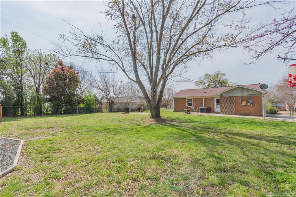 8002 Wynnview Road Indian Trail, NC 28079 - Photo 23 of 24 a front view of a house with garden