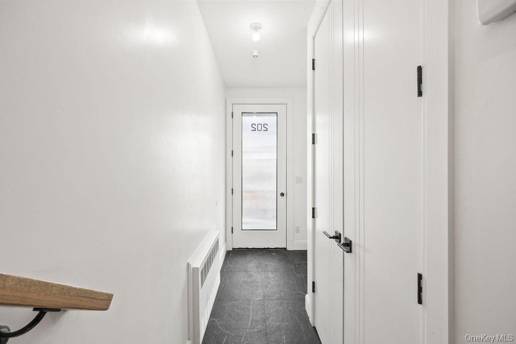 62 Blauvelt Road, Unit 202 Monsey, NY 10952 - Photo 3 of 34 a view of a hallway with wooden floor