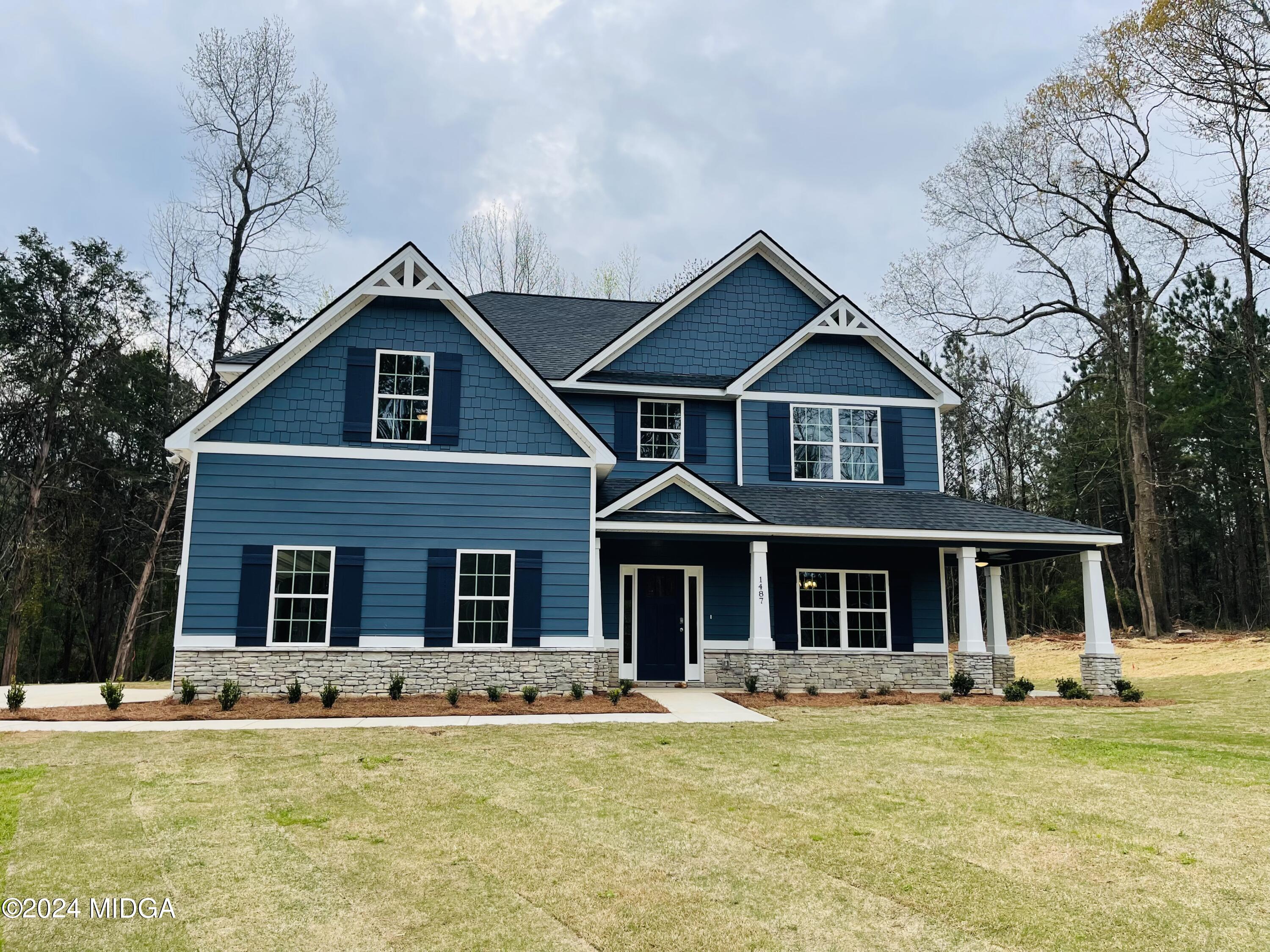 1487 Juliette Road Forsyth, GA 31029 - Photo 1 of 1 a front view of a house with swimming pool