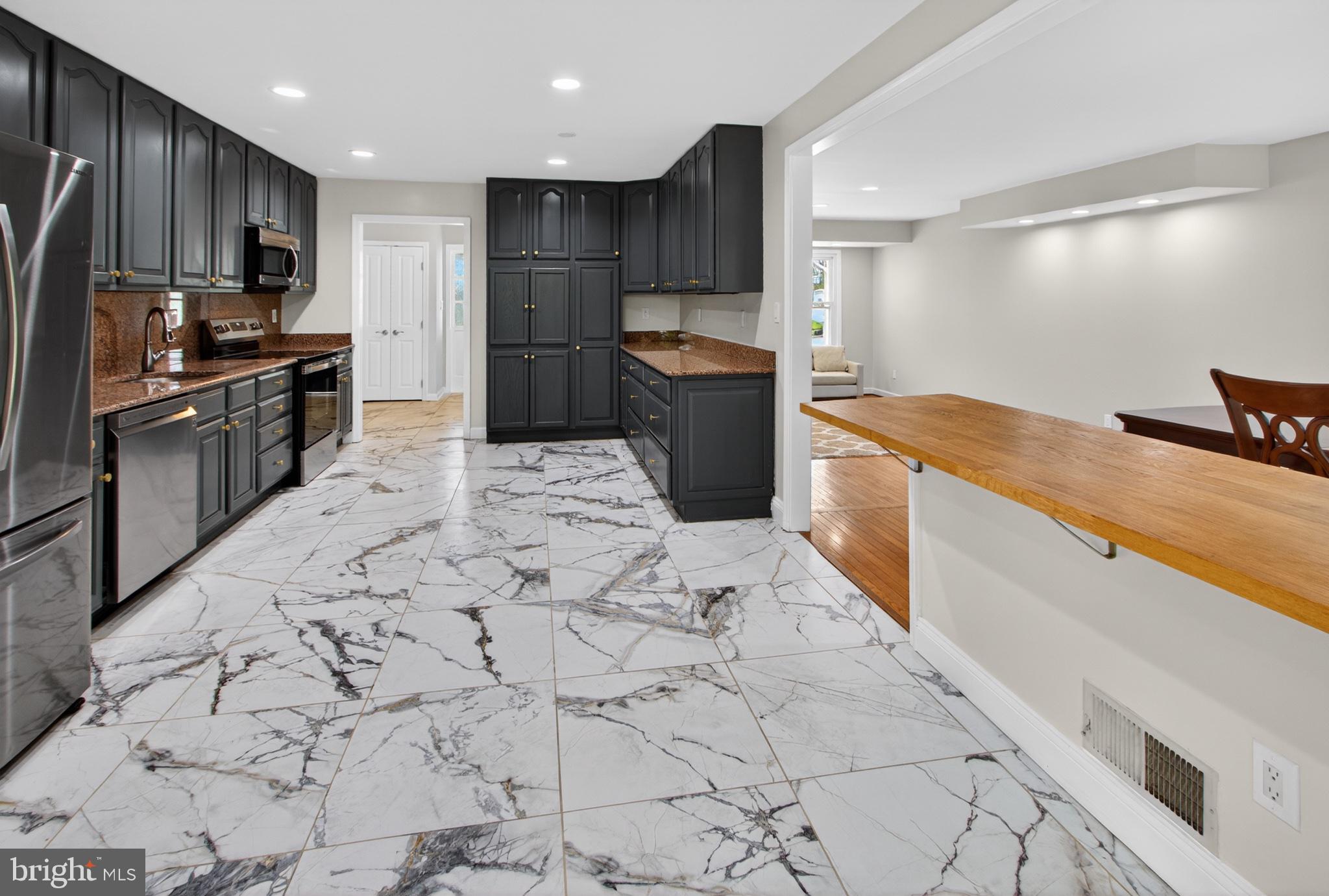 16 Redding Ridge Drive Gaithersburg, MD 20878 - Photo 39 of 53 Modern kitchen with elegant marble floors.