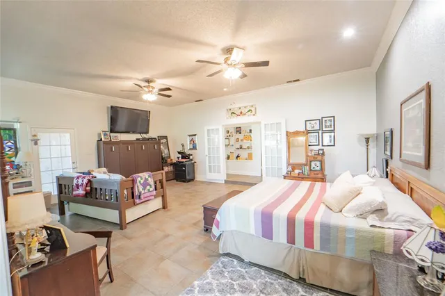 a bedroom with bed and a couch