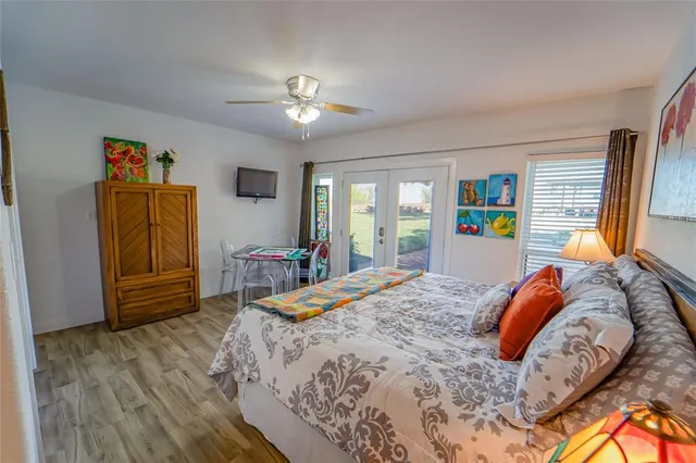 a bedroom with a bed dresser and a window