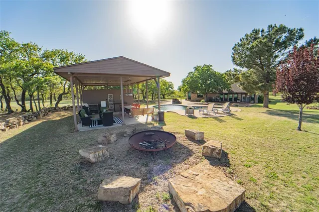 a view of a swimming pool with a patio