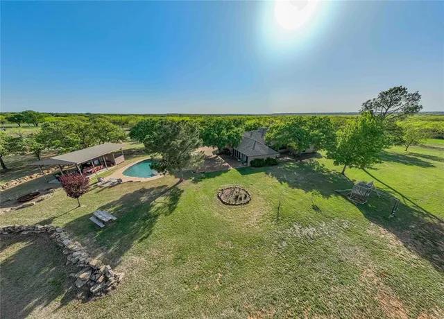 a view of a garden with an outdoor seating