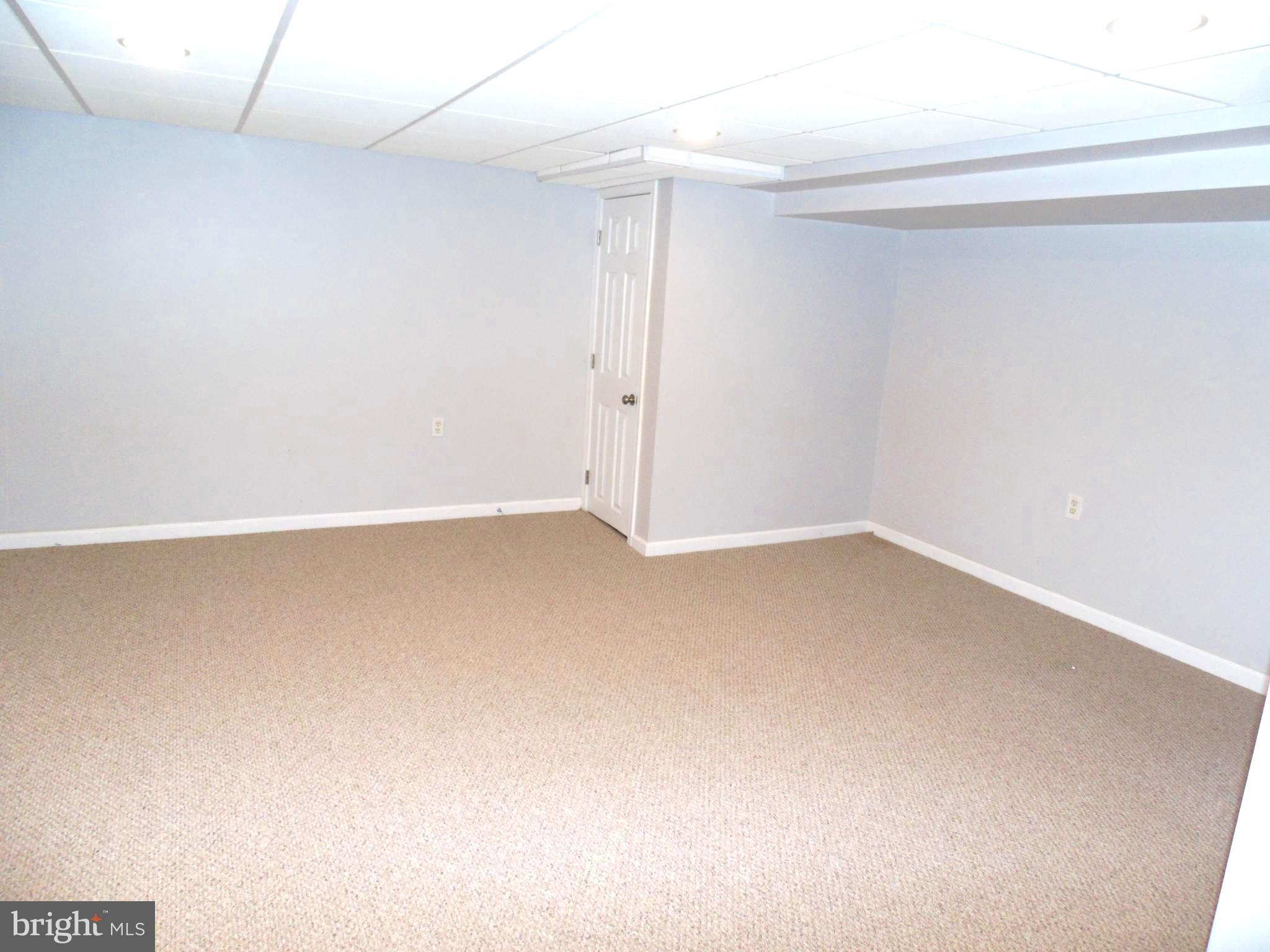 617 Middlesex Road Baltimore, MD 21221 - Photo 22 of 30 Spacious Finished Lower Level Rec Room