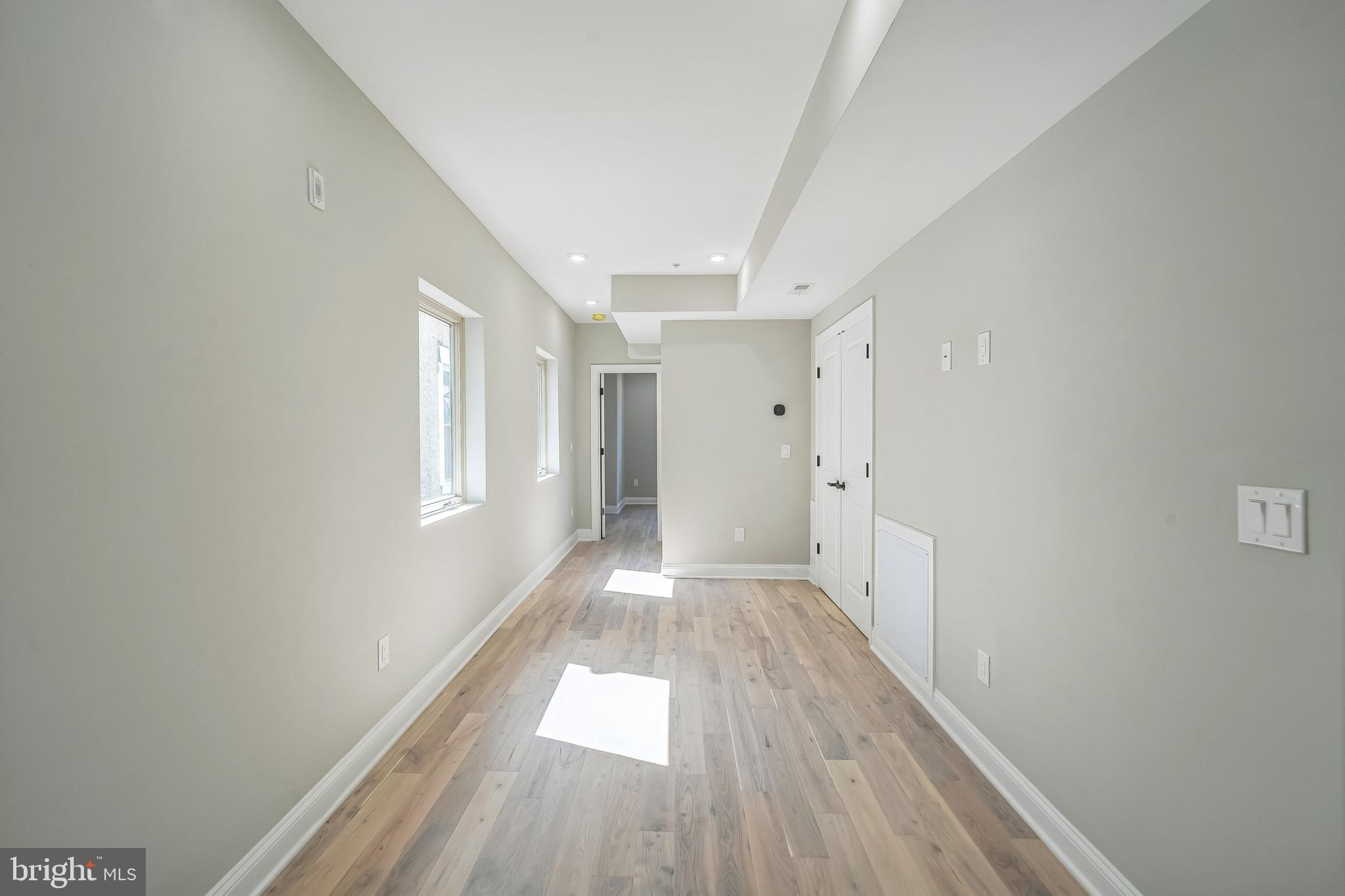 1702 South 22nd Street, Unit 3 Philadelphia, PA 19145 - Photo 16 of 22 a view of a hallway with wooden floor