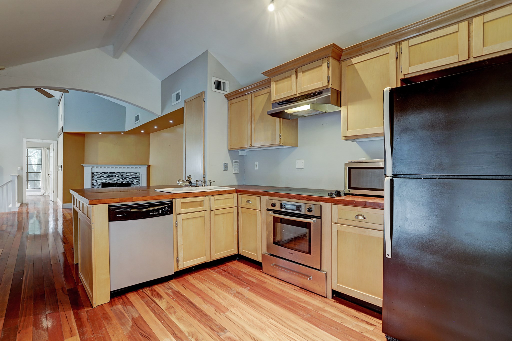 4320 Hazard Street Houston, TX 77098 - Photo 11 of 24 a kitchen with stainless steel appliances granite countertop a stove a sink and a refrigerator