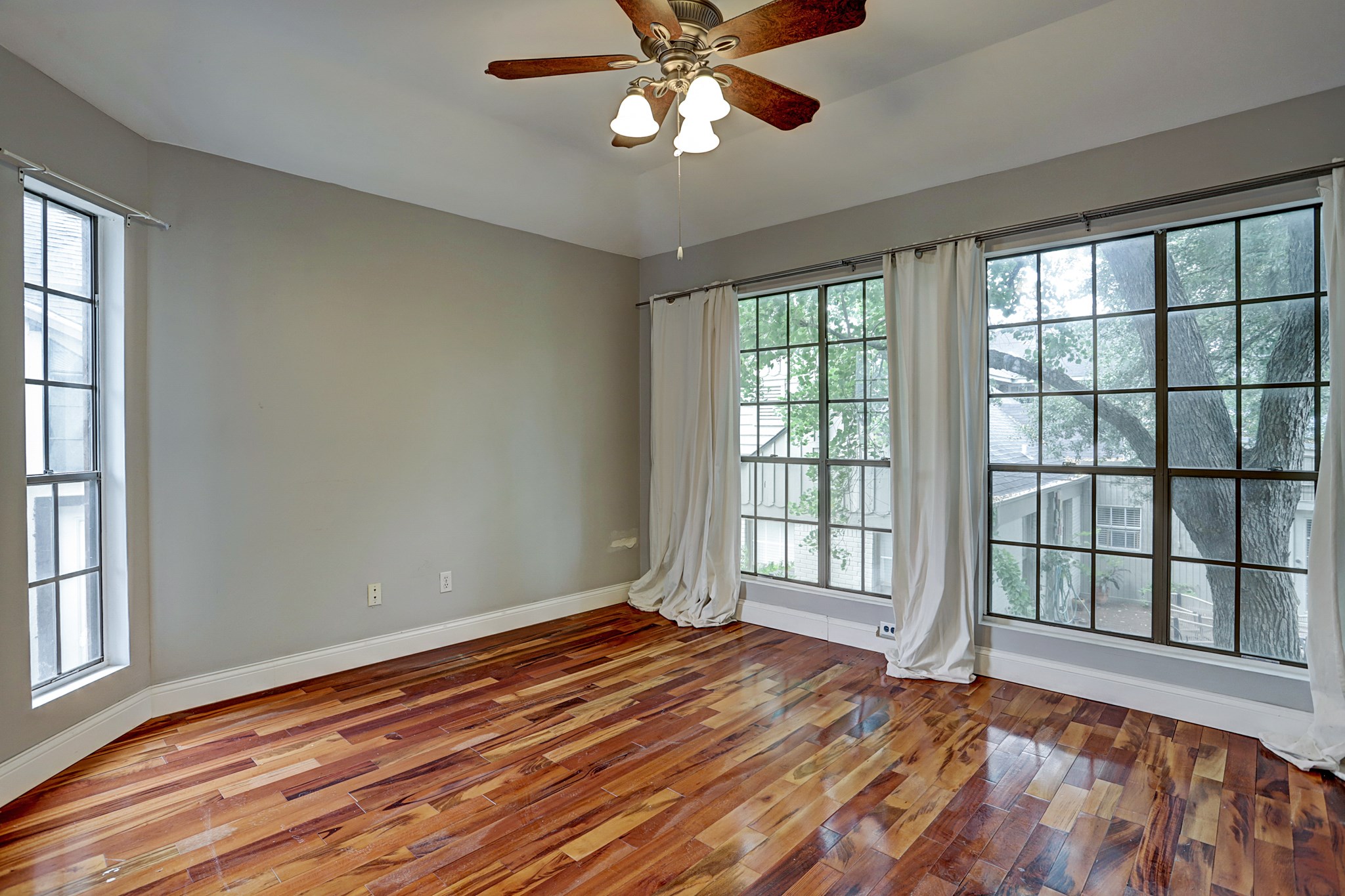 4320 Hazard Street Houston, TX 77098 - Photo 14 of 24 a view of an empty room with wooden floor and a window