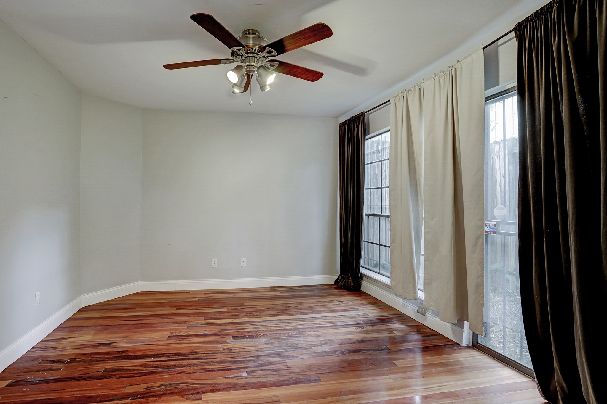 4320 Hazard Street Houston, TX 77098 - Photo 17 of 24 wooden floor in an empty room with a window