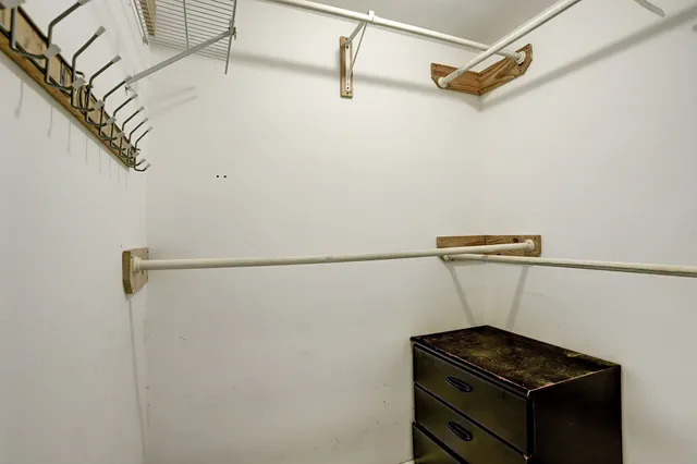 a view of storage and utility room with racks on the wall