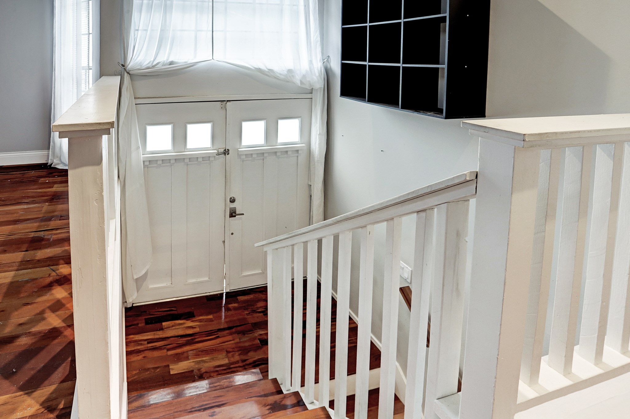 4320 Hazard Street Houston, TX 77098 - Photo 4 of 24 a view of staircase with wooden floor and windows