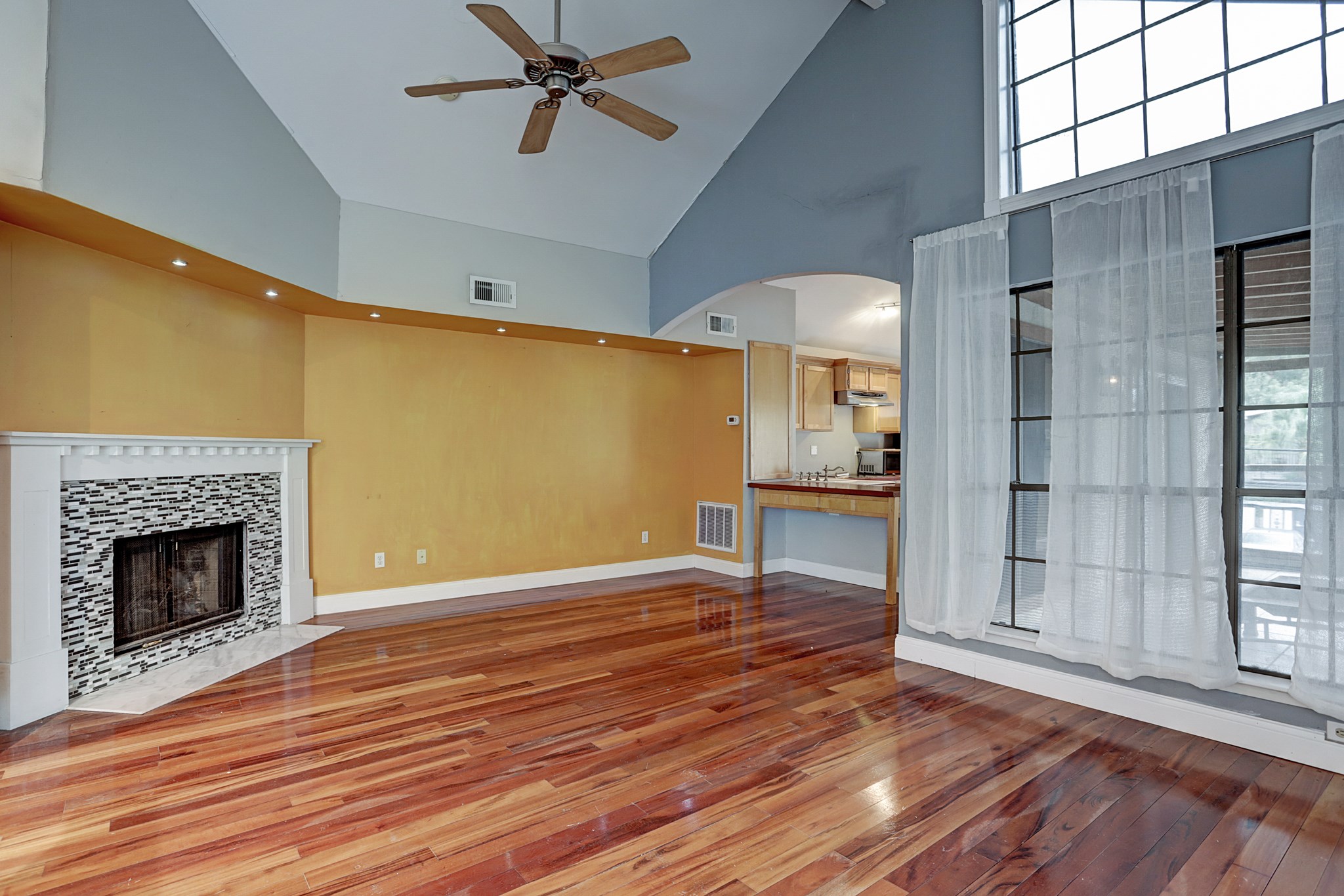 4320 Hazard Street Houston, TX 77098 - Photo 5 of 24 a view of a livingroom with wooden floor and a fireplace