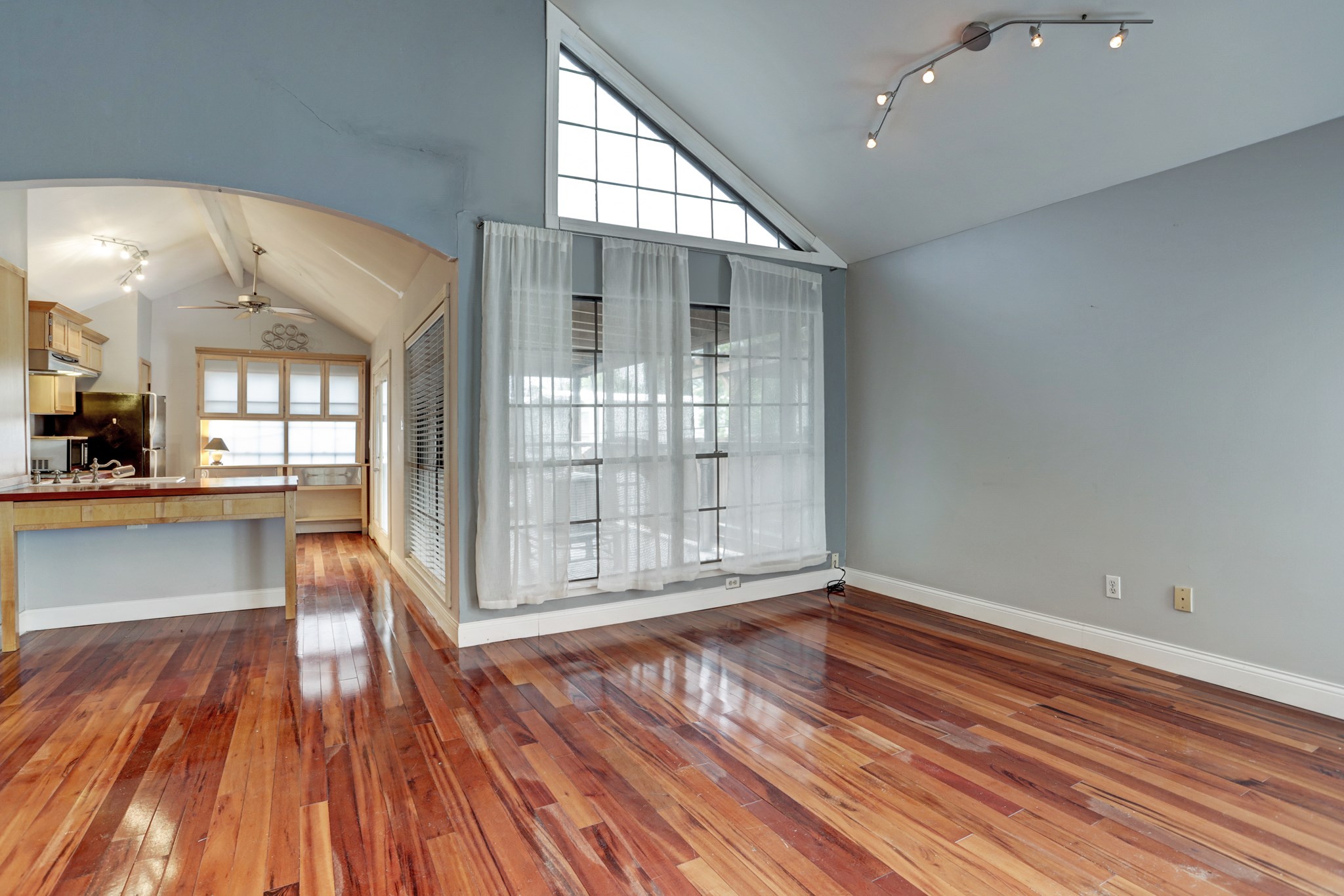 4320 Hazard Street Houston, TX 77098 - Photo 6 of 24 wooden floor in an empty room with a window