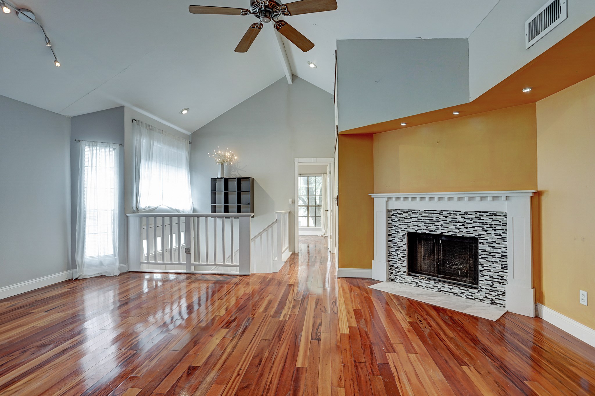 4320 Hazard Street Houston, TX 77098 - Photo 8 of 24 a view of a livingroom with wooden floor and a fireplace