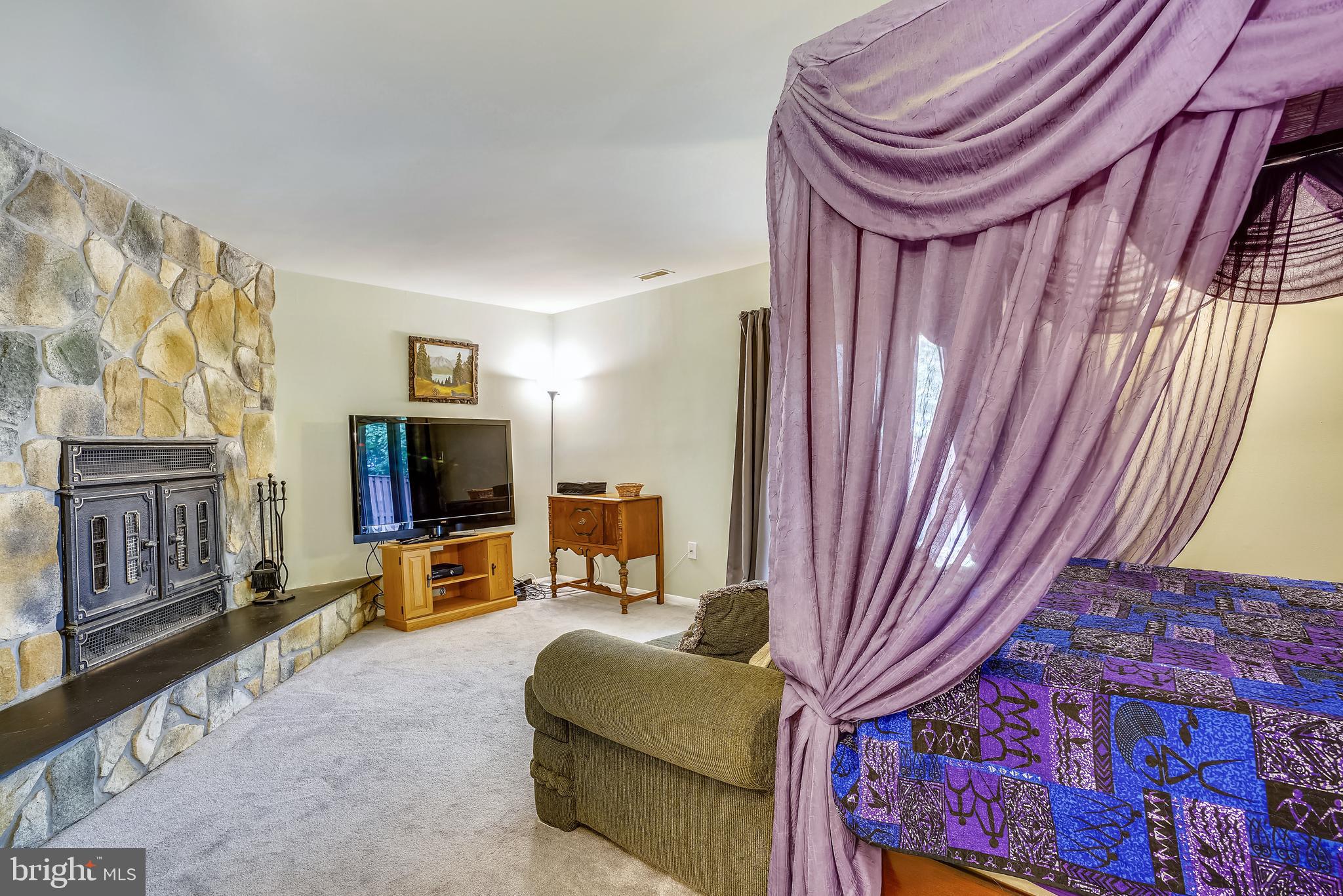 9753 Early Spring Way Columbia, MD 21046 - Photo 23 of 29 Family room with stone FP (curr used as bdrm)