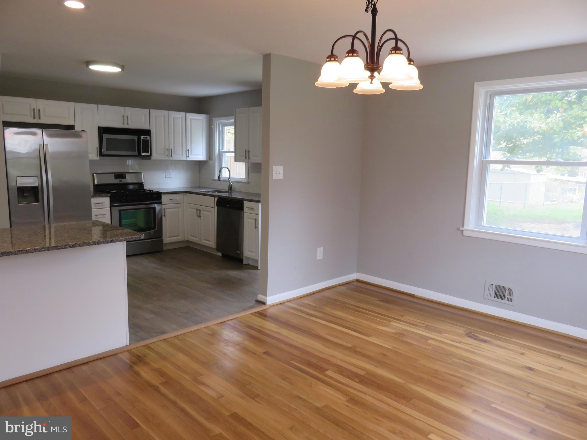 6840 Queens Ferry Road Baltimore, MD 21239 - Photo 10 of 28 DINING ROOM OPEN TO KITCHEN WITH BREAKFAST FAR