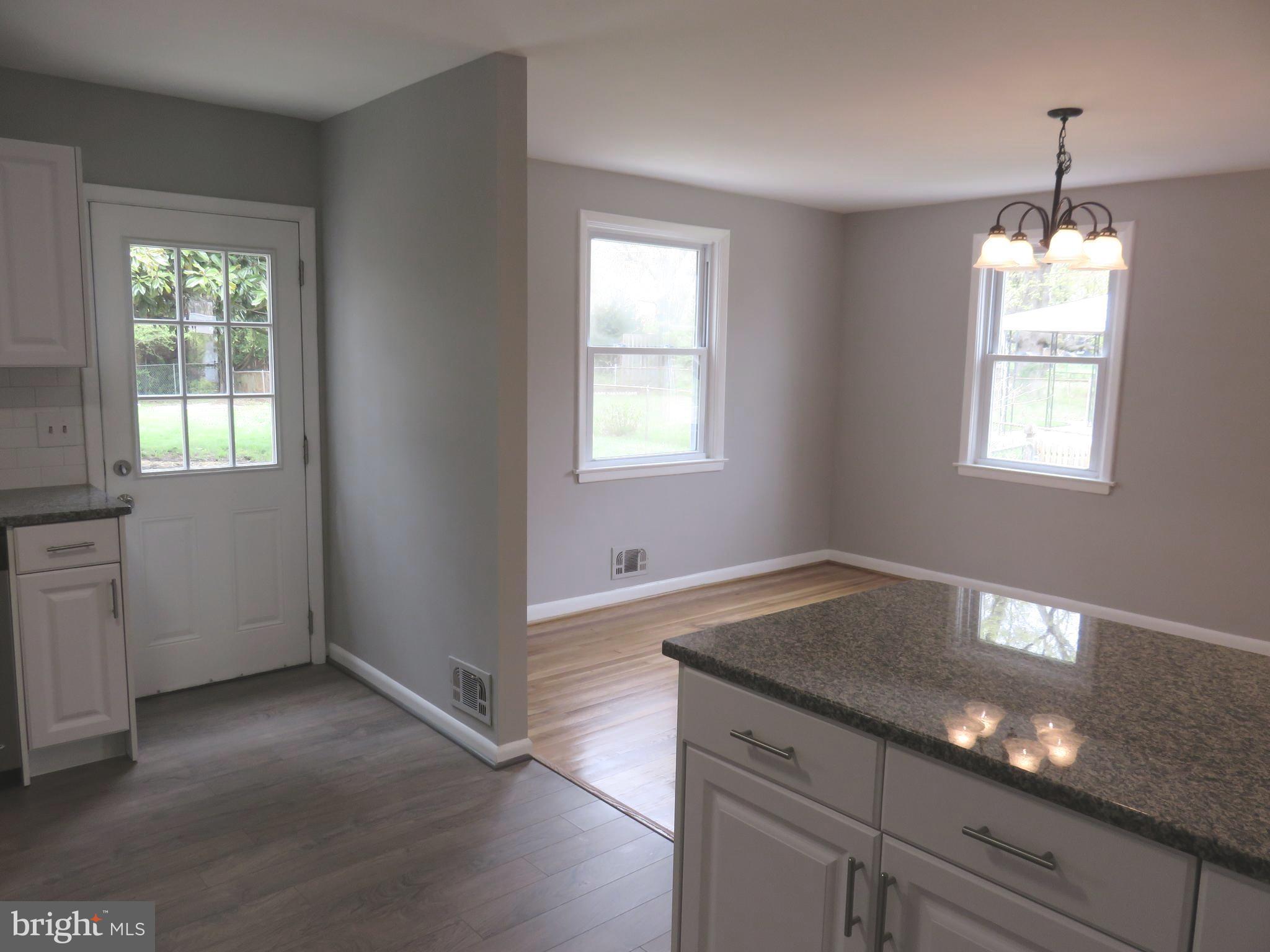 6840 Queens Ferry Road Baltimore, MD 21239 - Photo 11 of 28 DOOR FROM KITCHEN TO HUGE BACK YARD