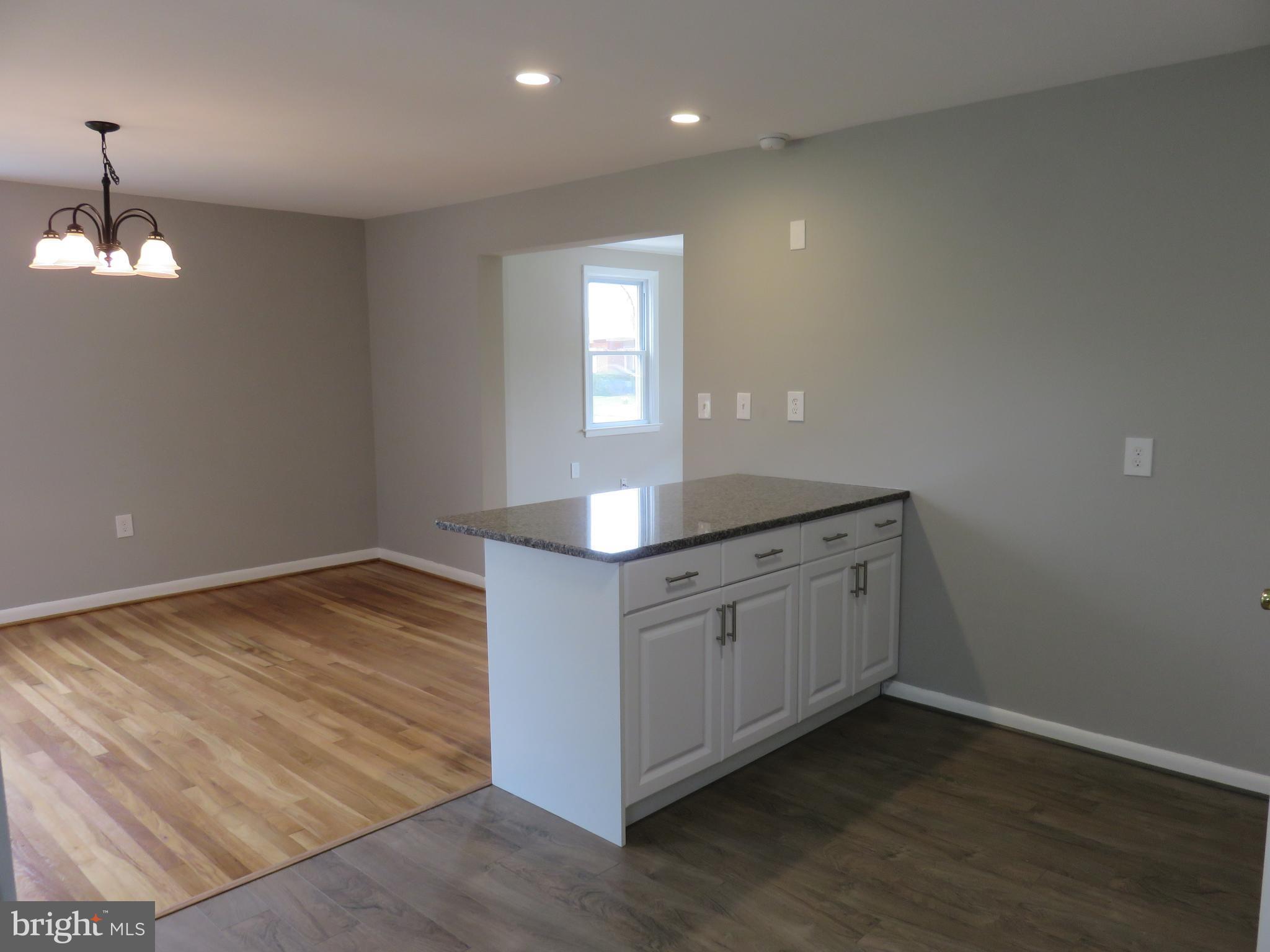 6840 Queens Ferry Road Baltimore, MD 21239 - Photo 12 of 28 ADDED CABINET SPACE IN BREAKFAST BAR