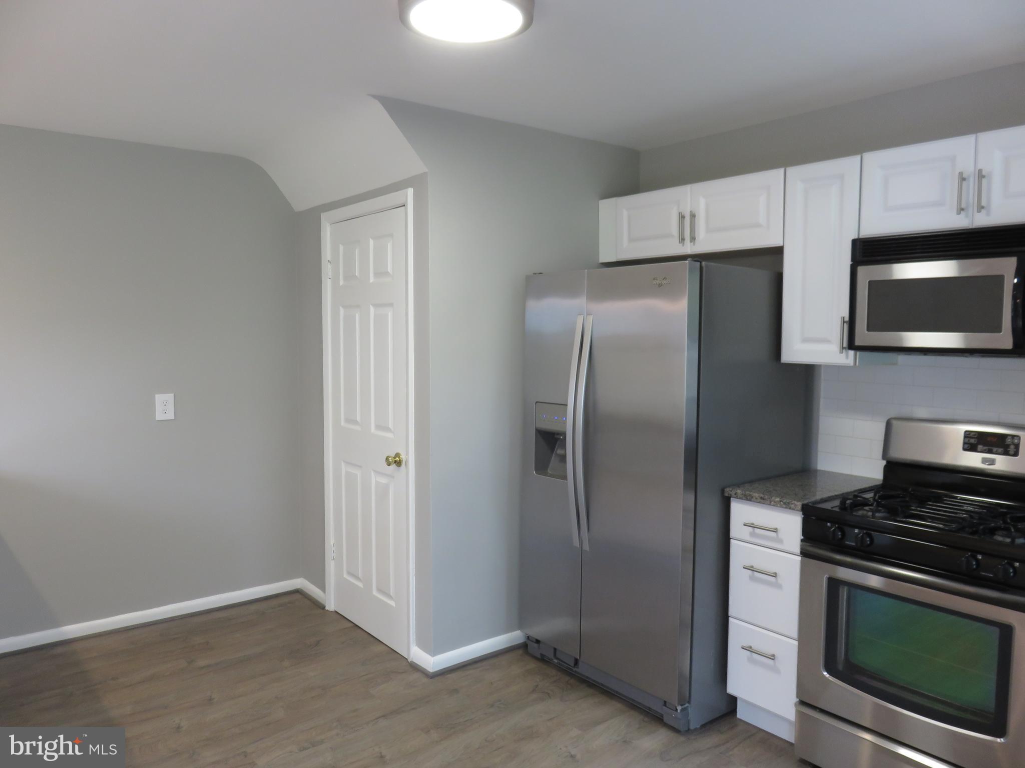 6840 Queens Ferry Road Baltimore, MD 21239 - Photo 13 of 28 DOOR TO FINISHED LOWER LEVEL